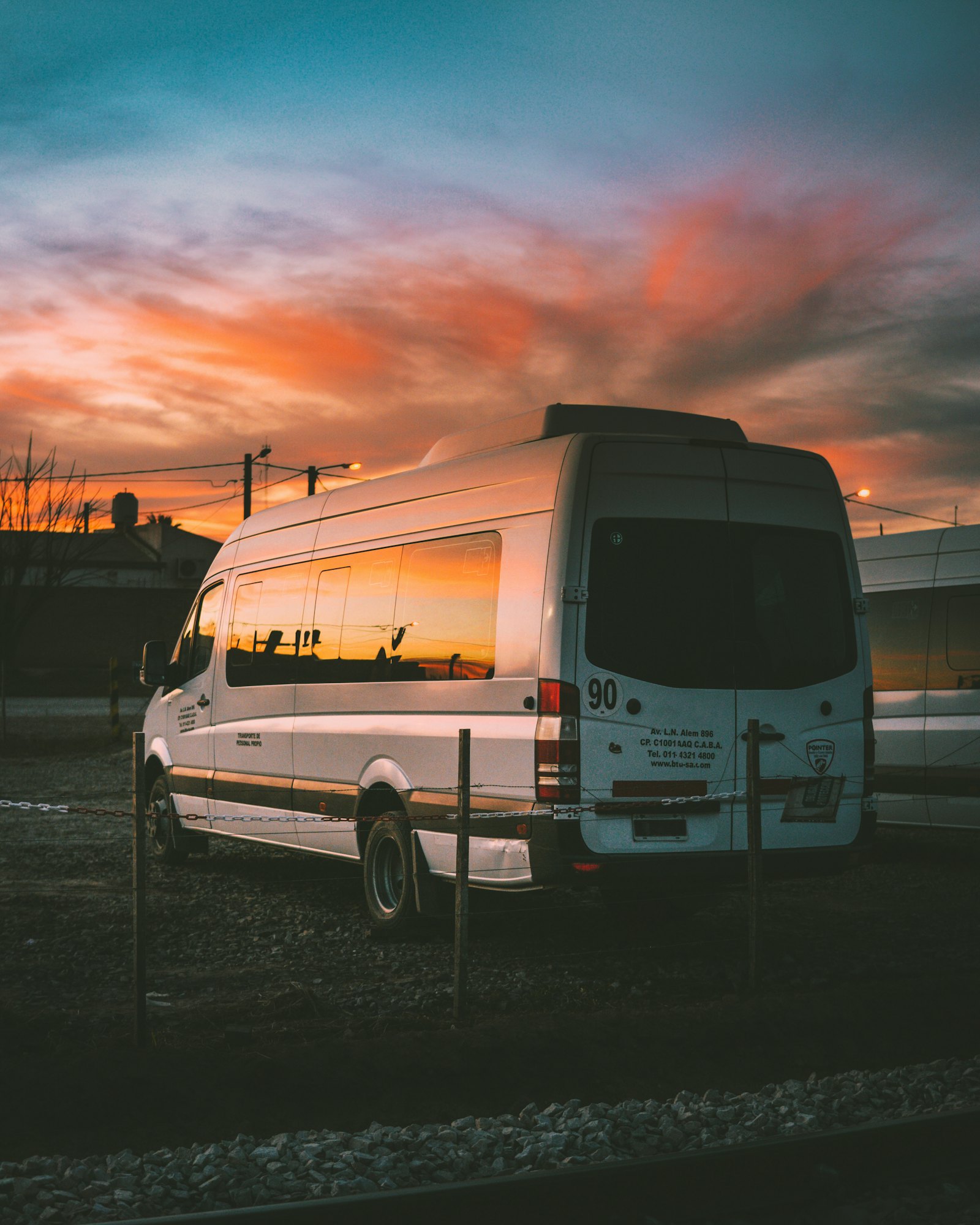 A high-roof passenger van parked at golden hour (placeholder photo)